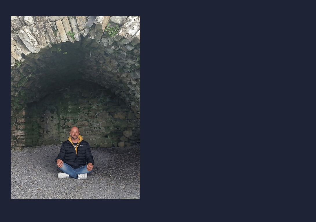 Matthew Patti meditating at a spiritual site in Ireland